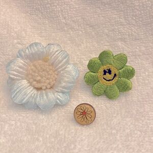 Three flower pins